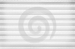Rolling steel door texture or roller shutter door , white grey  background