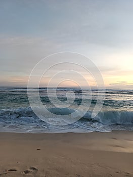 Rolling waves on Seminyak beach, Bali