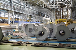 Rolls of aluminum lie in production shop of plant