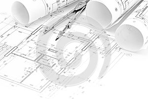 Architectural drawings with floor plan, blueprint rolls and drawing compass