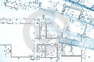 Rolls of architecture blueprints and plan with ruler