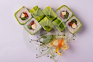 rolls with avocado and microgreens closeup on a white background1