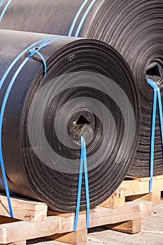 Rolls of black industrial plastic