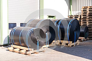 Rolls of black industrial plastic