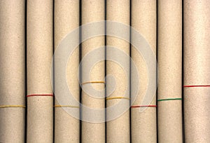 Rolls of brown paper with plastic band texture for background