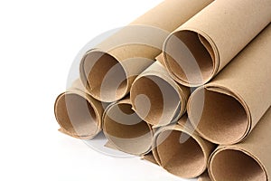 Rolls of brown paper on white background