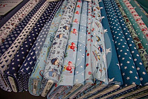 Rolls of cloth in different patterns