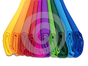 Rolls of colored corrugated paper closeup on white back