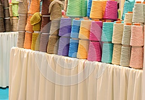 rolls of colored wool cotton thread during sale in a haberdashery counter