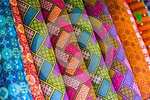 Rolls of colorful African fabric in a market