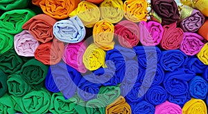 Rolls of colorful cloth in a cloth shop