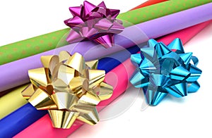 Rolls of colorful wrapping paper on white background