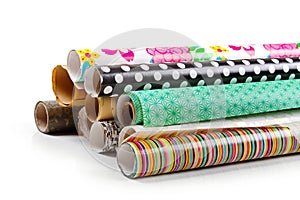 Rolls of colorful wrapping paper isolated on white