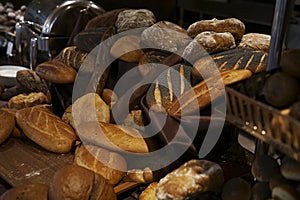 Many rolls of different breads in the bakery restaurant