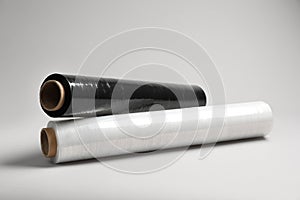 Rolls of different stretch wrap on light grey background
