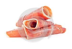 Rolls of dry-cured spanish serrano ham isolated