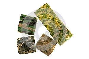 Rolls of fabric camouflage pattern stretchable bandage tape isolated on white background.