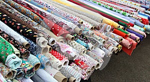 Rolls of fabric material at market