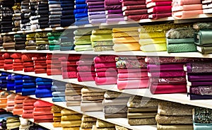 Rolls of fabric and textiles in a factory shop or store