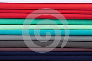 Rolls of fabric and textiles in the shop, Multiple roles of colorful cloth, Drapery shop. Fabric rolls in textile store