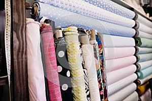 Rolls of fabrics in dressmaker\'s Atelier. Small business. Nobody. fabrics shop