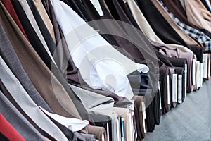 Rolls of fabrics and textiles on market stand for sale -  Turkish market, Berlin