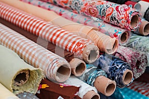 Rolls of  fabrics and textiles. Sewing and fashion industry concept