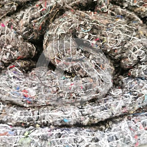 Rolls of factory textiles close-up. construction fabric for insulation in a roll