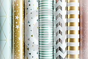 Rolls of festive wrapping paper as background