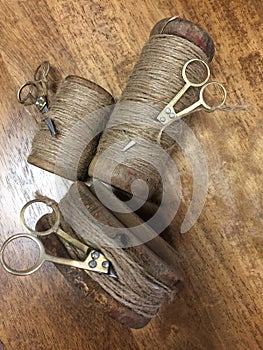 Rolls of hemp ropes and metal scissors