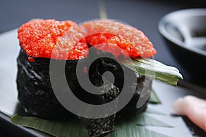 Rolls of Ikura gunkan maki sushi.