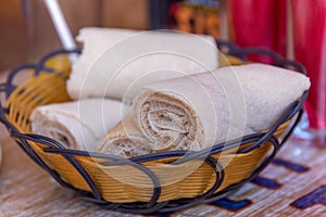 Rolls of Injera in a serving bowl