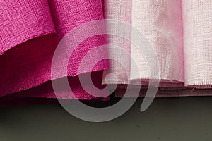 Rolls of linen fabric of different colors