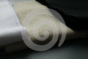 Rolls of linen fabric of different colors