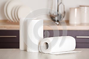 Rolls of paper towels on table photo