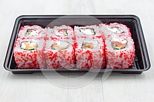 Rolls in a plastic container. Fast food, food delivery.