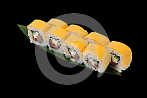 Rolls with salmon, chedar cheese, cream cheese, nori, cucumber and bell pepper, over black background with copy space