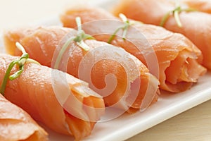 Rolls of smoked salmon as a snack