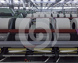 Rolls of spun cotton in a textile factory