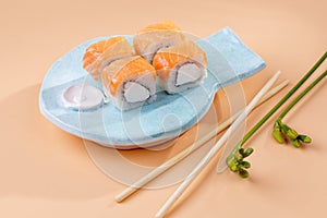 rolls and sushi on a plate in the form of fish