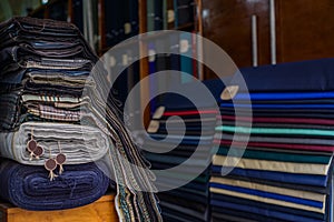 Rolls of textiles in a fabric shop. Multi colors and patterns.