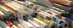 Rolls of textiles, fabrics of various colors on sale