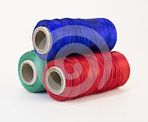 Rolls of thread with RGB colors.