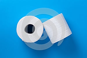 Rolls Of Toilet Paper Over Blue Background