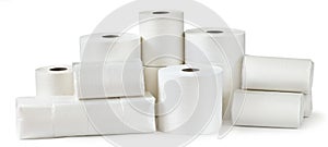 Rolls of toilet paper, paper towels and packs of napkins isolated on white photo