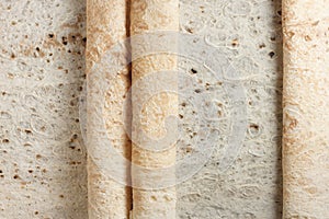 Rolls of traditional asian flat bread, texture photo