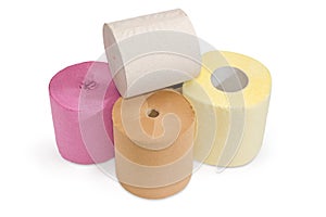 Rolls of various toilet paper different colors on white background
