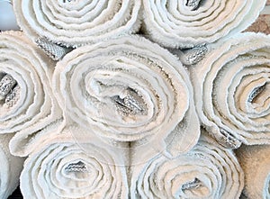 Rolls of white towels background