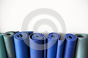 Rolls of yoga mats at a fitness center