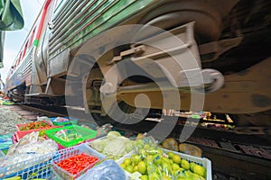 Rom Hoop market. Thai Railway with a local train run through Mae Klong Market in Samut Songkhram Province, Thailand. Tourist